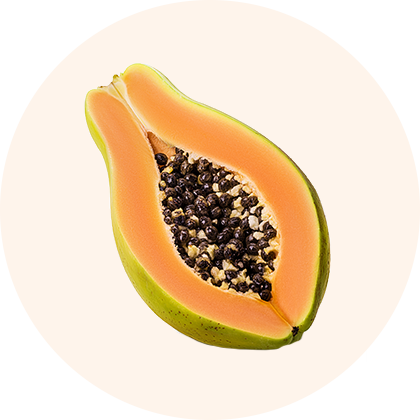 A halved papaya with black seeds and orange flesh.